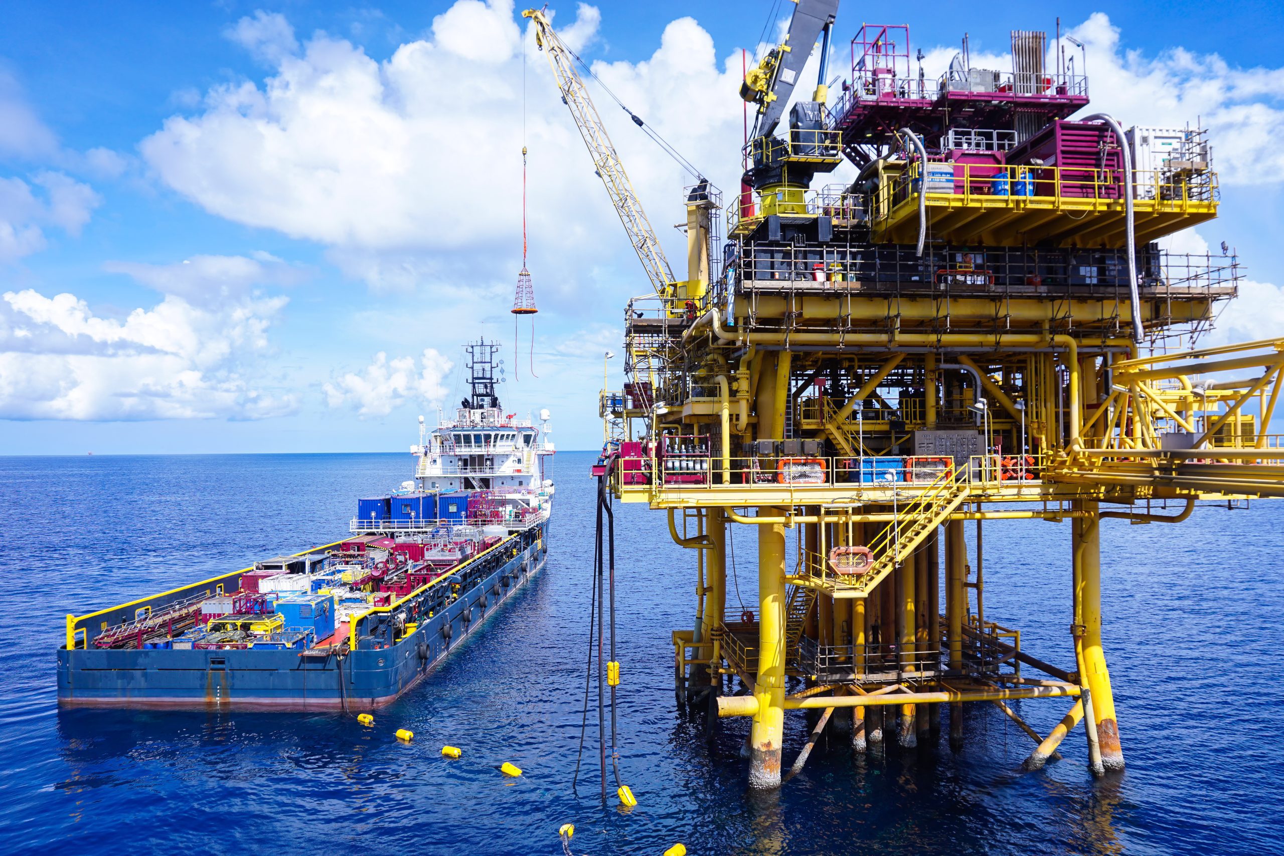 Offshore oil and gas platform in The Middle of The Sea ,Offshore supply boat working at sea ,Thailand Offshore oil and gas platform in The Middle of The Sea ,Offshore supply boat working at sea ,Thailand